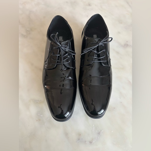 Unlisted by Kenneth Cole Men\'s 
H-EEL THE WORLD Black Patent Leather Dress Shoes